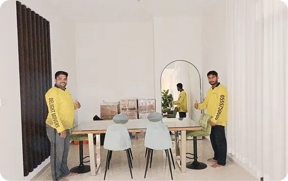 Delight furniture movers arranging a dining room after a move in Abu Dhabi